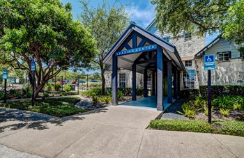Entrance to Leasing Office with lush green landscape Entrance to Leasing Office with lush green landscape